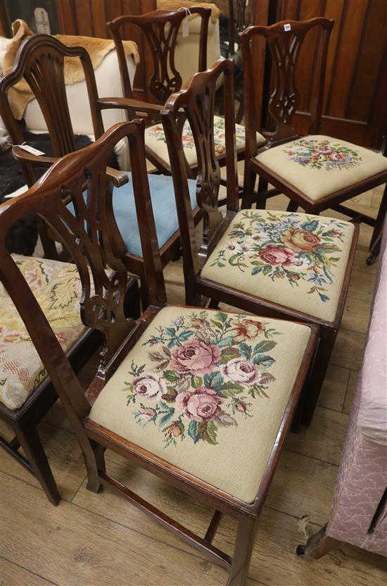A set of four Chippendale style mahogany dining chairs with tapestry seats